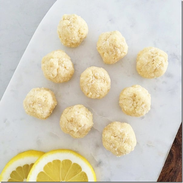 Easy lemon coconut protein balls; Gluten Free, Dairy Free, High Protein; carrotsncake.com; photo of lemon protein balls on baking sheet
