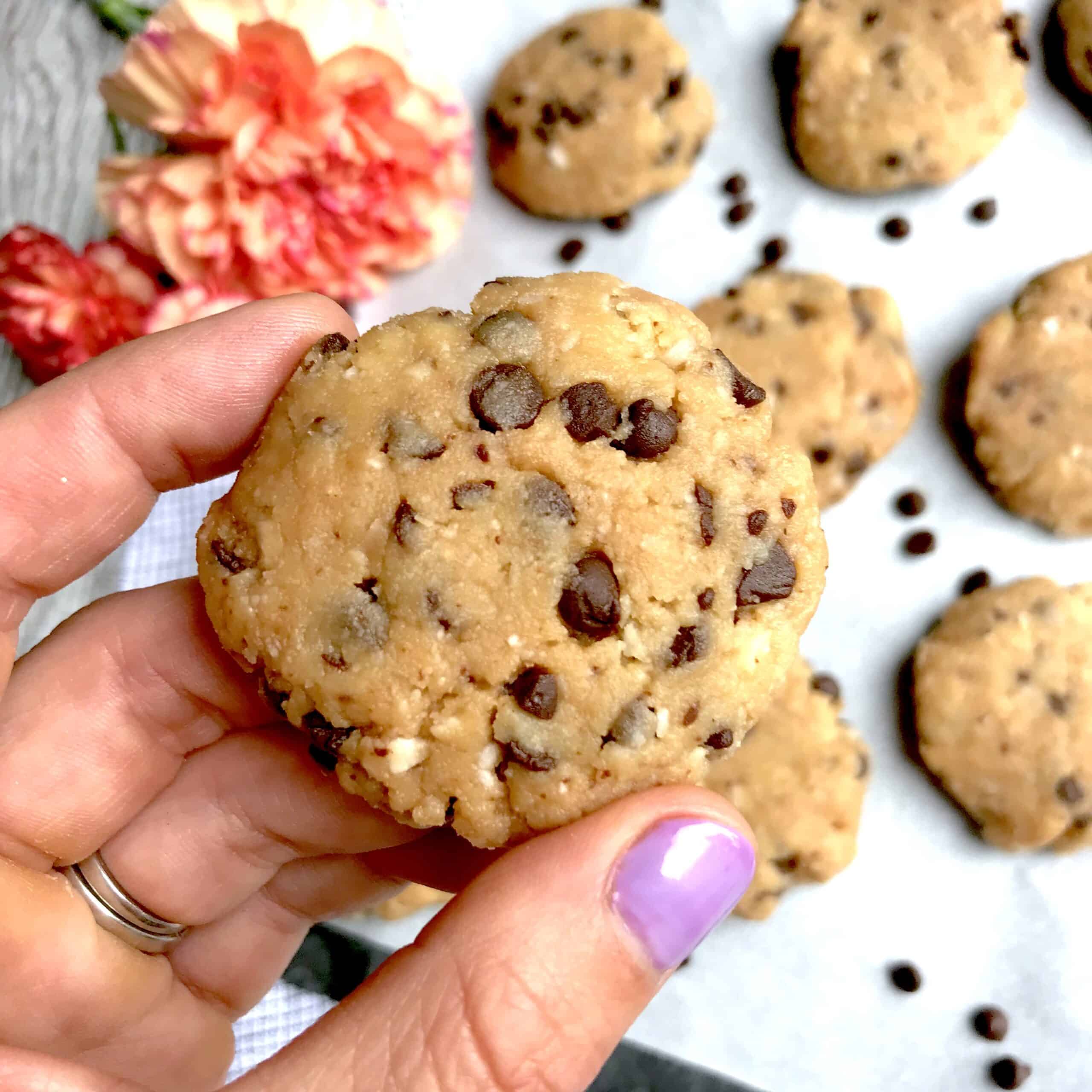 The cookies contain almond flour, shredded coconut, coconut butter, honey, and dairy-free chocolate chips. As a result, the combination of flavors reminds me of an Almond Joy candy bar. Mmm!