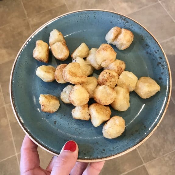 Photo of cooked cauliflower gnocchi on a plate 