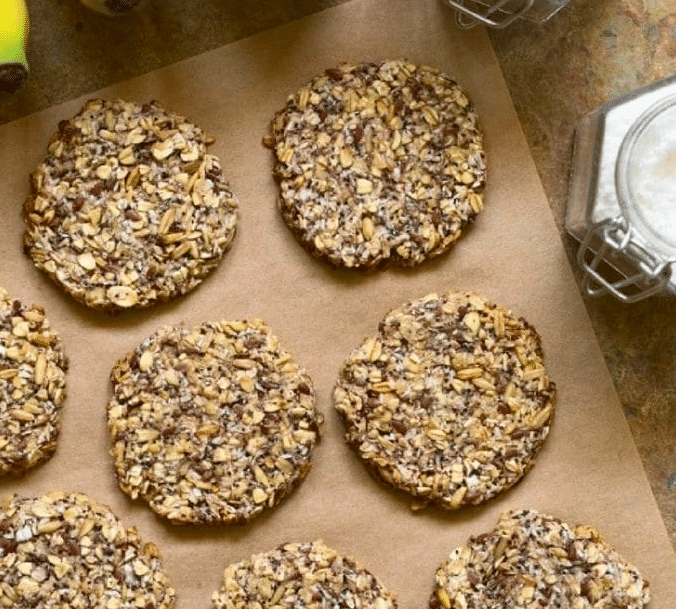 banana flax protein cookies cooling on parchment paper