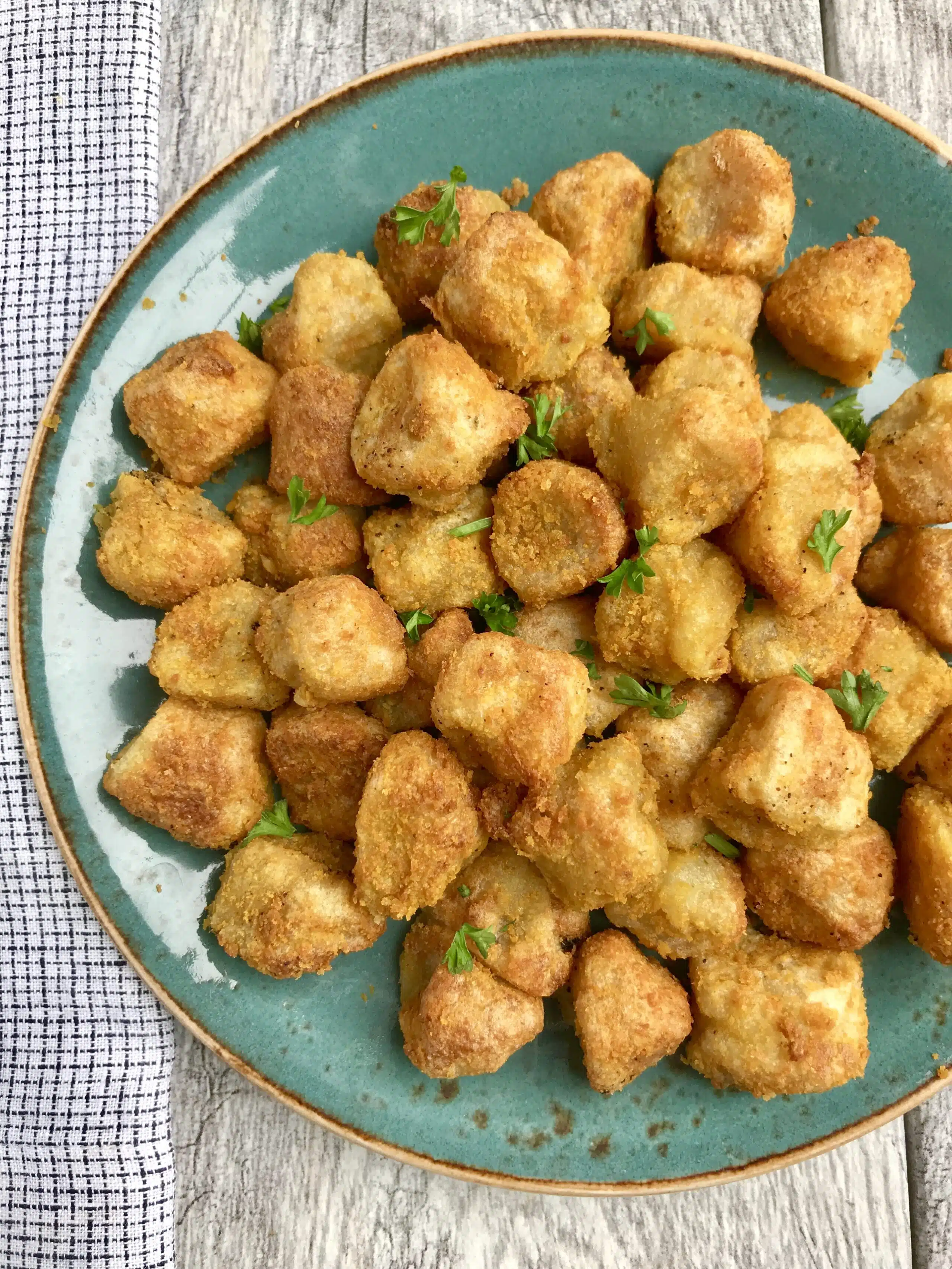 This crispy & "cheesy" vegan cauliflower gnocchi recipe, made with just 4 ingredients in an air fryer, is an easy and delicious way to prepare Trader Joe's infamous cauliflower gnocchi. Gluten-free, dairy-free, and vegan.