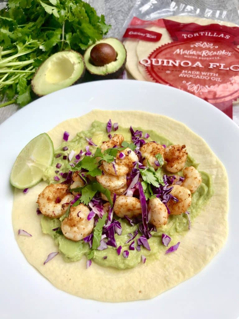 Overhead shot of Air Fryer Shrimp Taco on a round white plate served with a slice of lime.